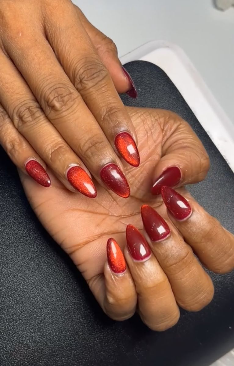 Red cat-eye gel nails at Cindy Glow, Dubai